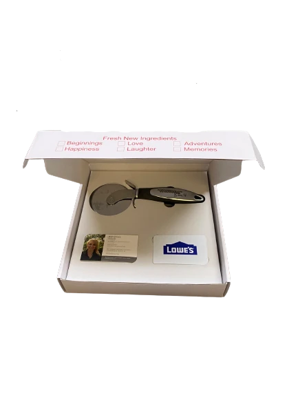 Open pizza gift box showing the stainless steel cutter and spaces for gift and business cards